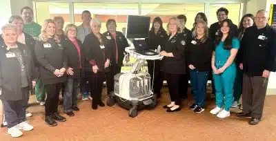 Members of the Cabell Huntington Hospital Auxiliary and the Cabell Huntington Hospital Ultrasound Department pose with a new Philips Epiq 7 ultrasound machine.